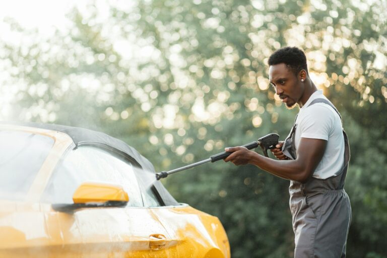 washing-outside-rearview-car-mirror-with-high-pressure-water-at-self-car-wash-service-outdoors-.jpg